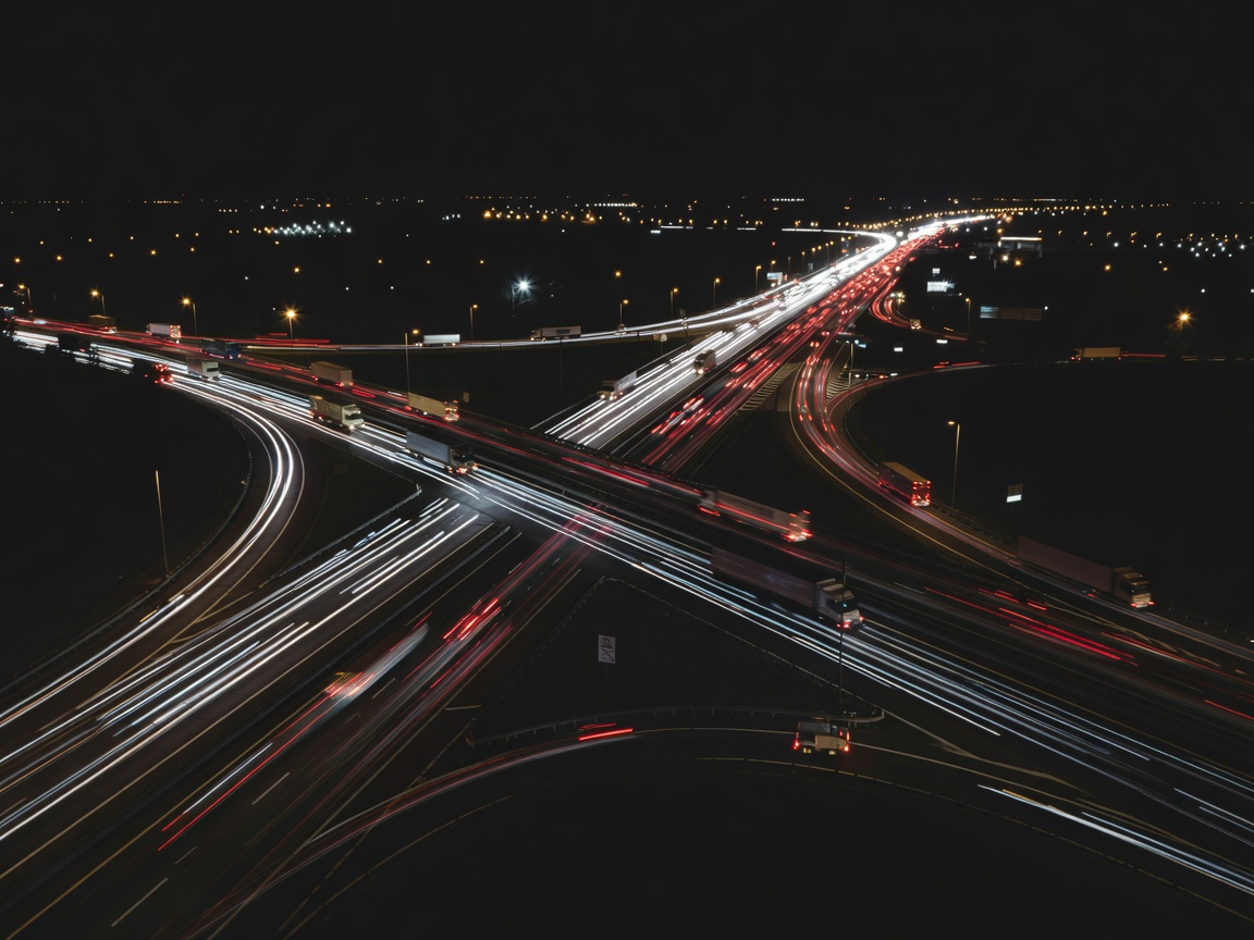 Abstract nighttime long exposure of highway traffic representing distribution routes